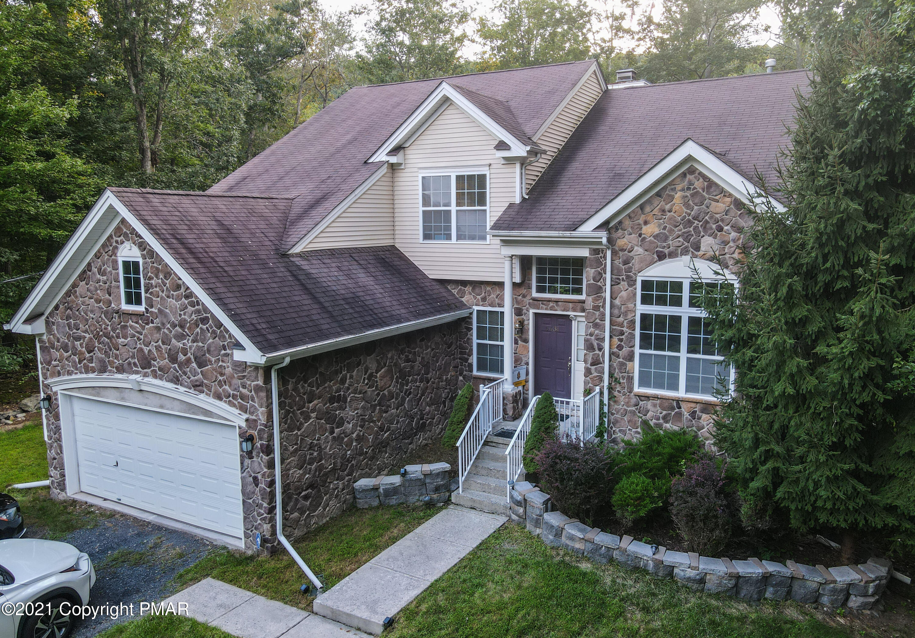 5631 Decker Road Bushkill, PA 18324 - Photo 4 of 61 a house view with a garden space