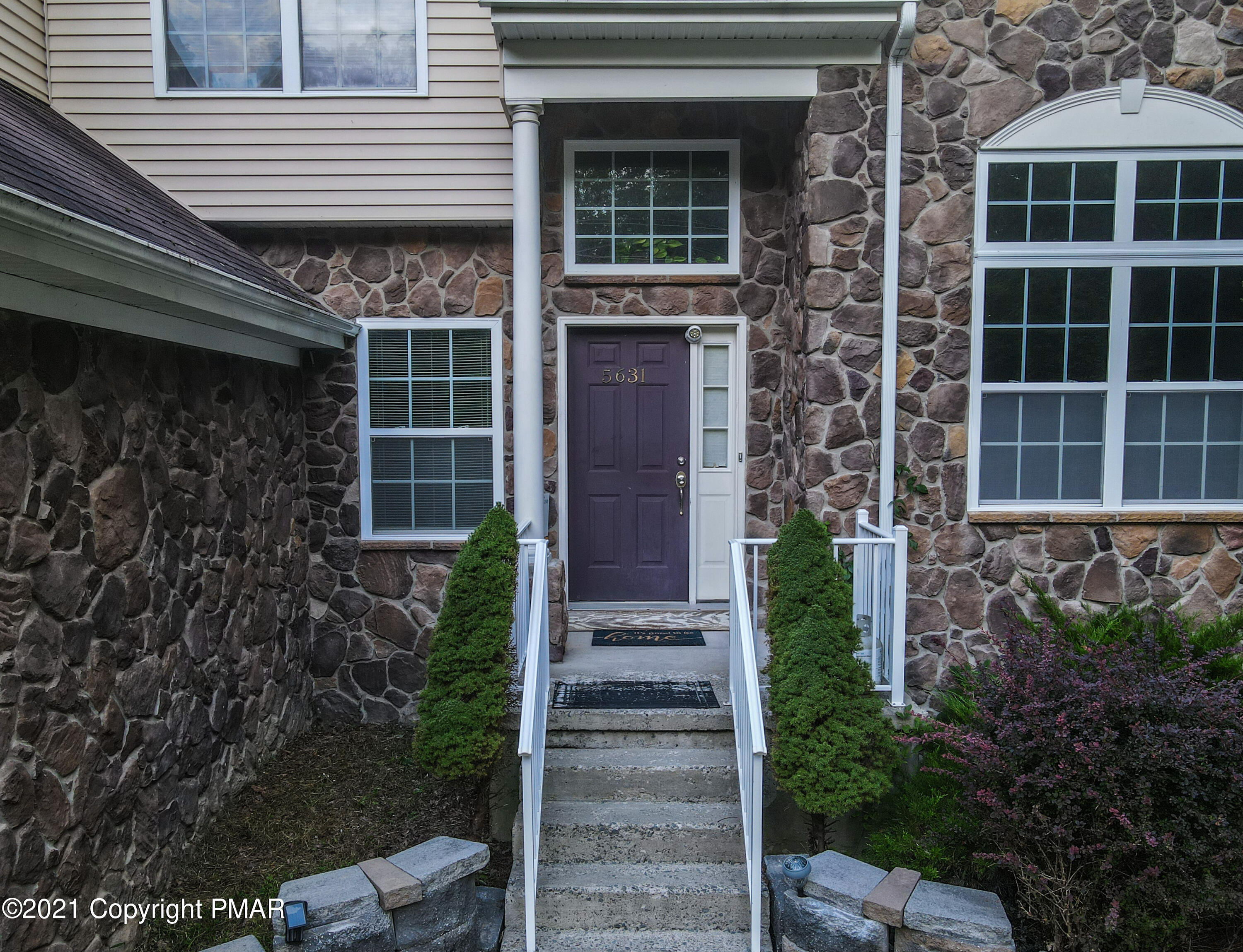 5631 Decker Road Bushkill, PA 18324 - Photo 5 of 61 a front view of a house with a garden