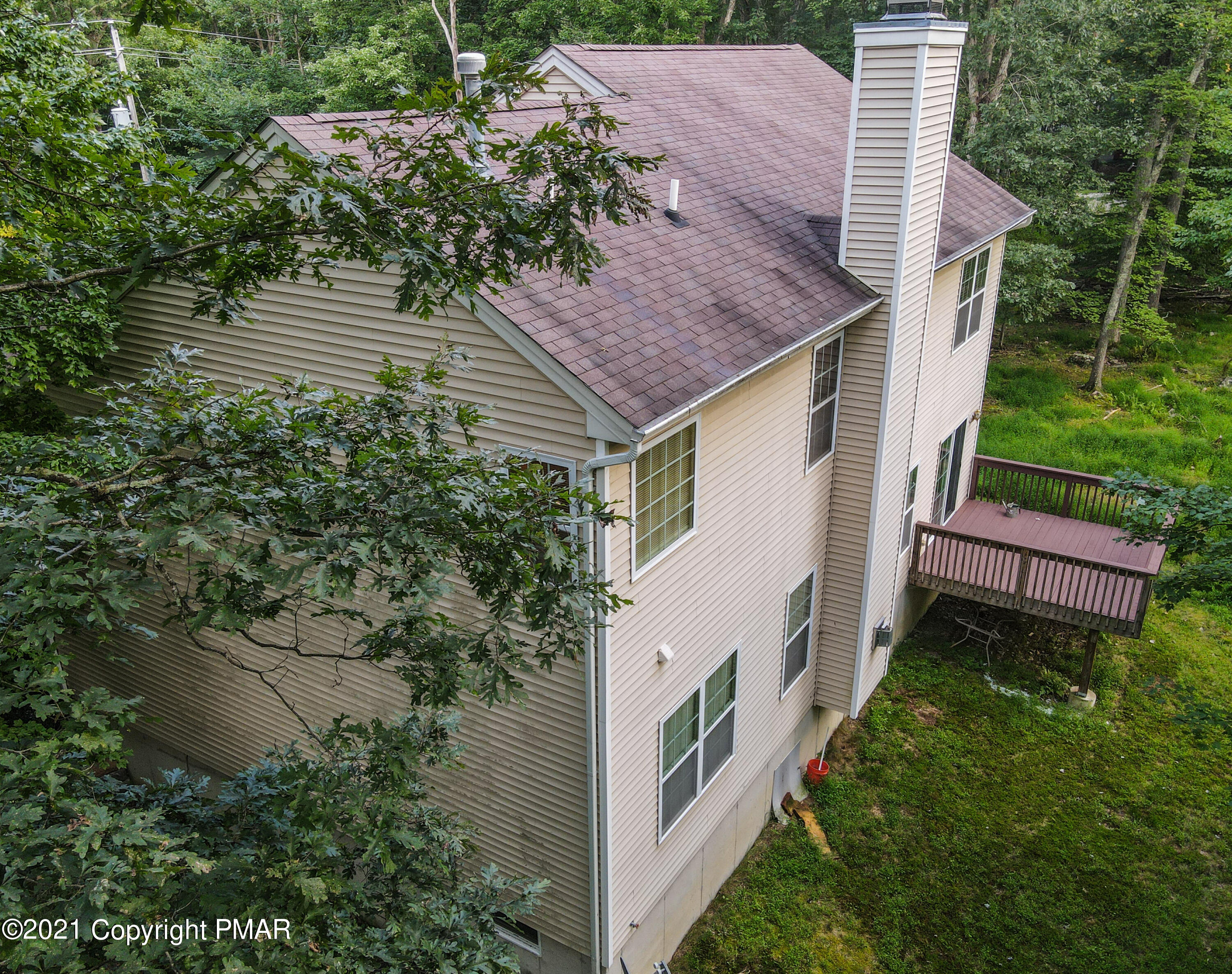 5631 Decker Road Bushkill, PA 18324 - Photo 53 of 61 a aerial view of a house with a yard and potted plants