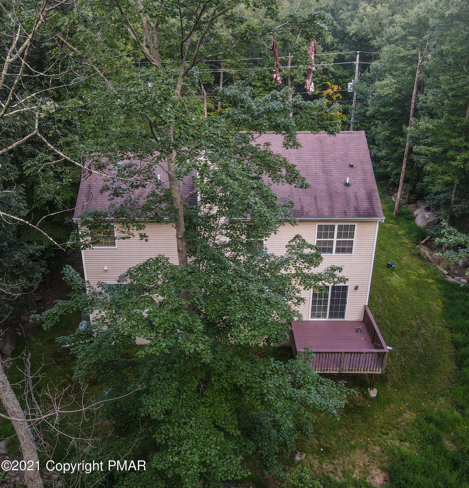 5631 Decker Road Bushkill, PA 18324 - Photo 56 of 61 an aerial view of a house with yard and outdoor seating