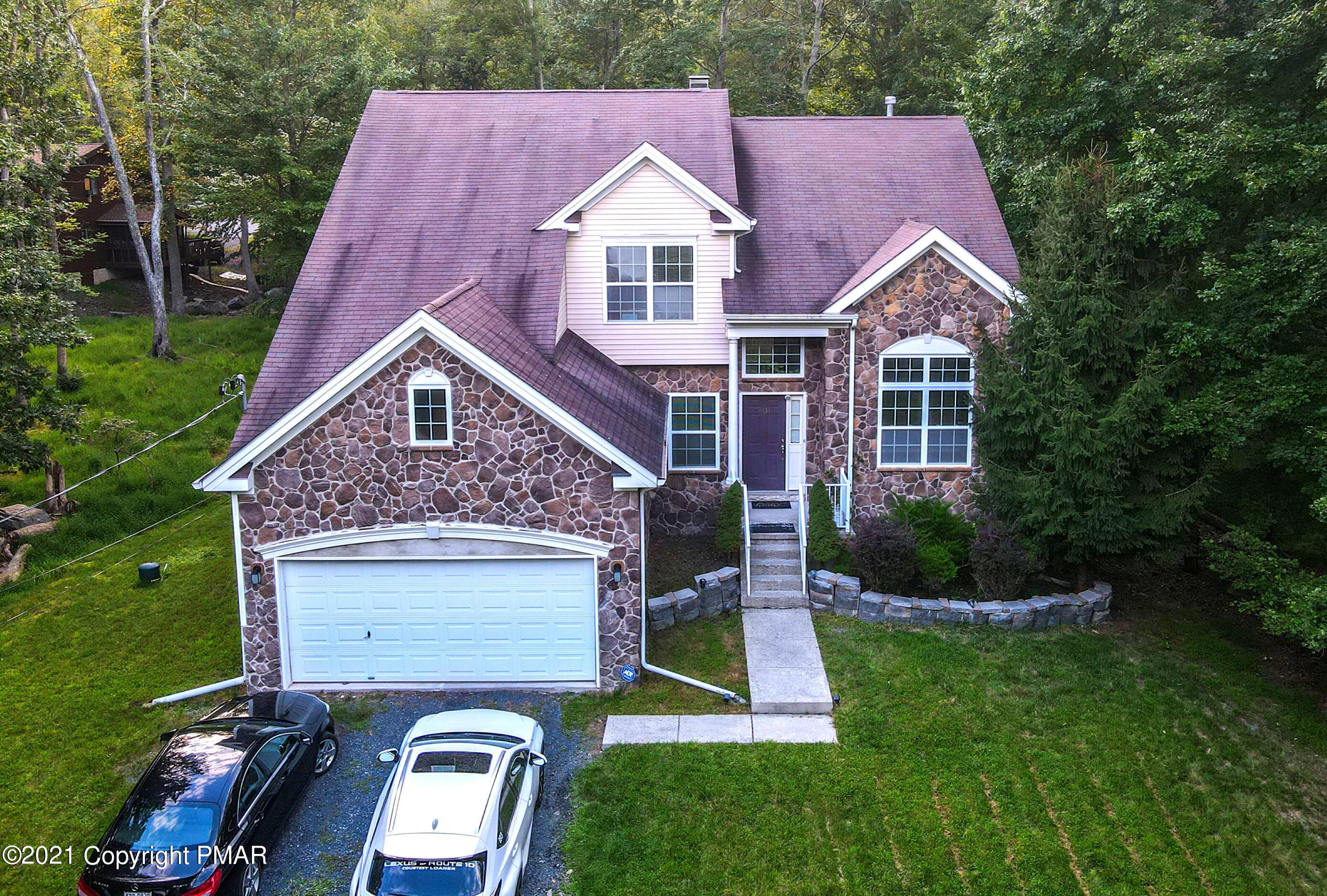 5631 Decker Road Bushkill, PA 18324 - Photo 58 of 61 a aerial view of a house next to a yard
