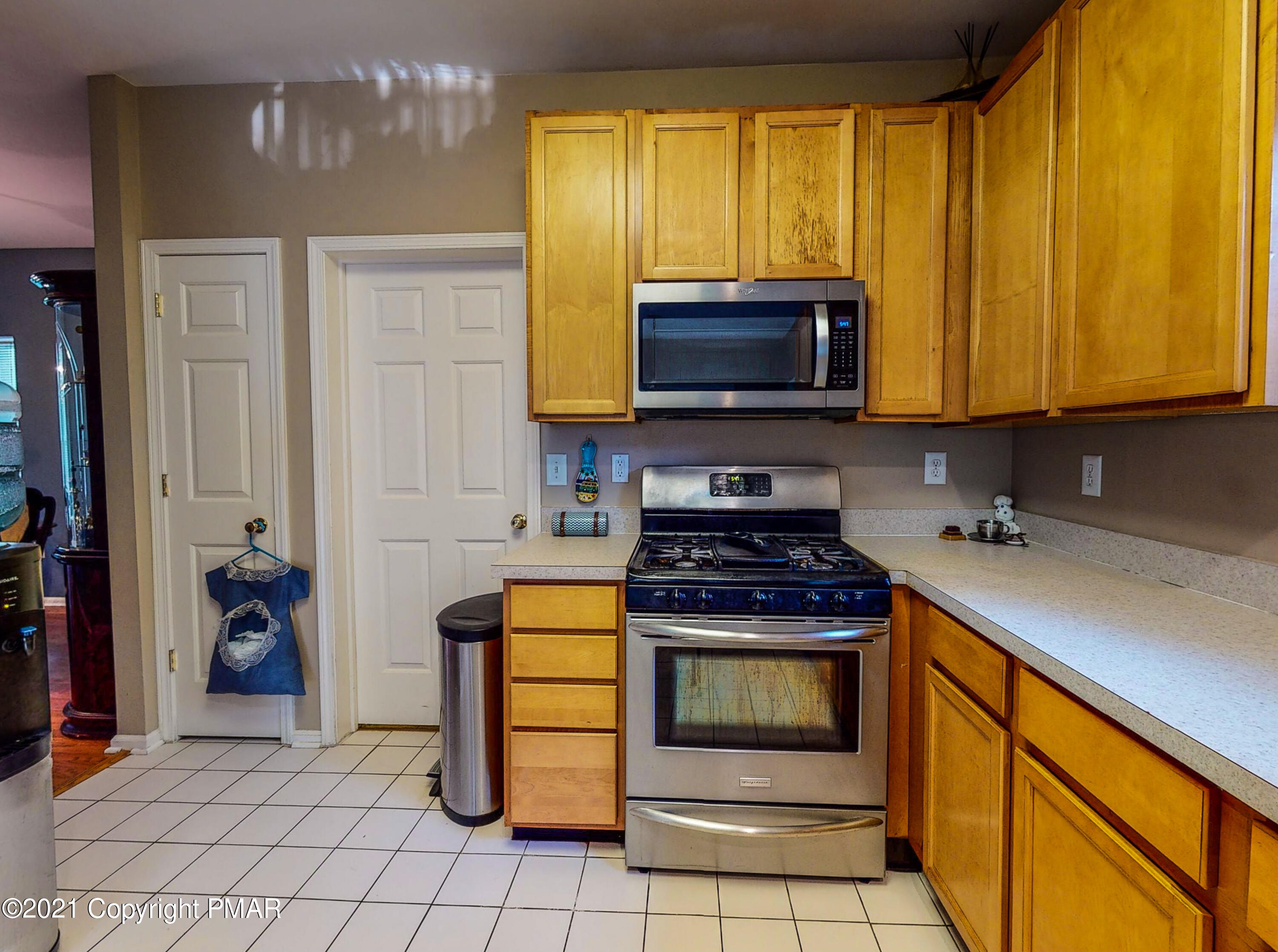 5631 Decker Road Bushkill, PA 18324 - Photo 8 of 61 a kitchen with a stove top oven cabinets and a refrigerator