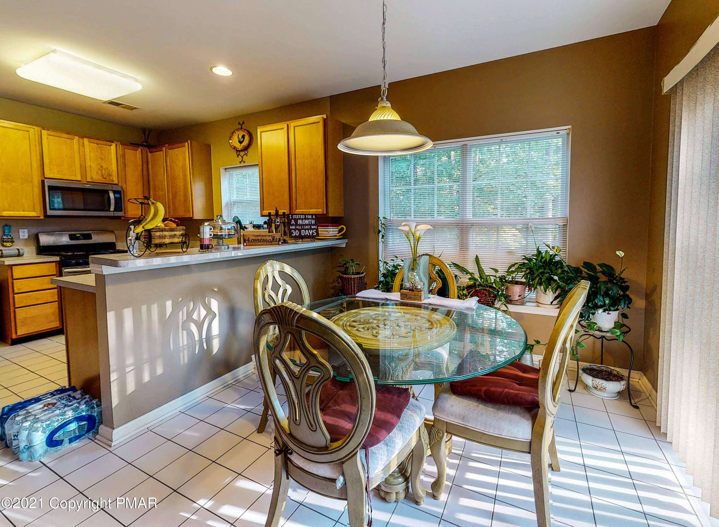 5631 Decker Road Bushkill, PA 18324 - Photo 9 of 61 a dinning table and chairs in a room