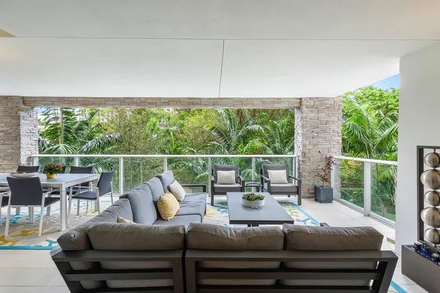 a kitchen with stainless steel appliances kitchen island granite countertop a refrigerator and a stove