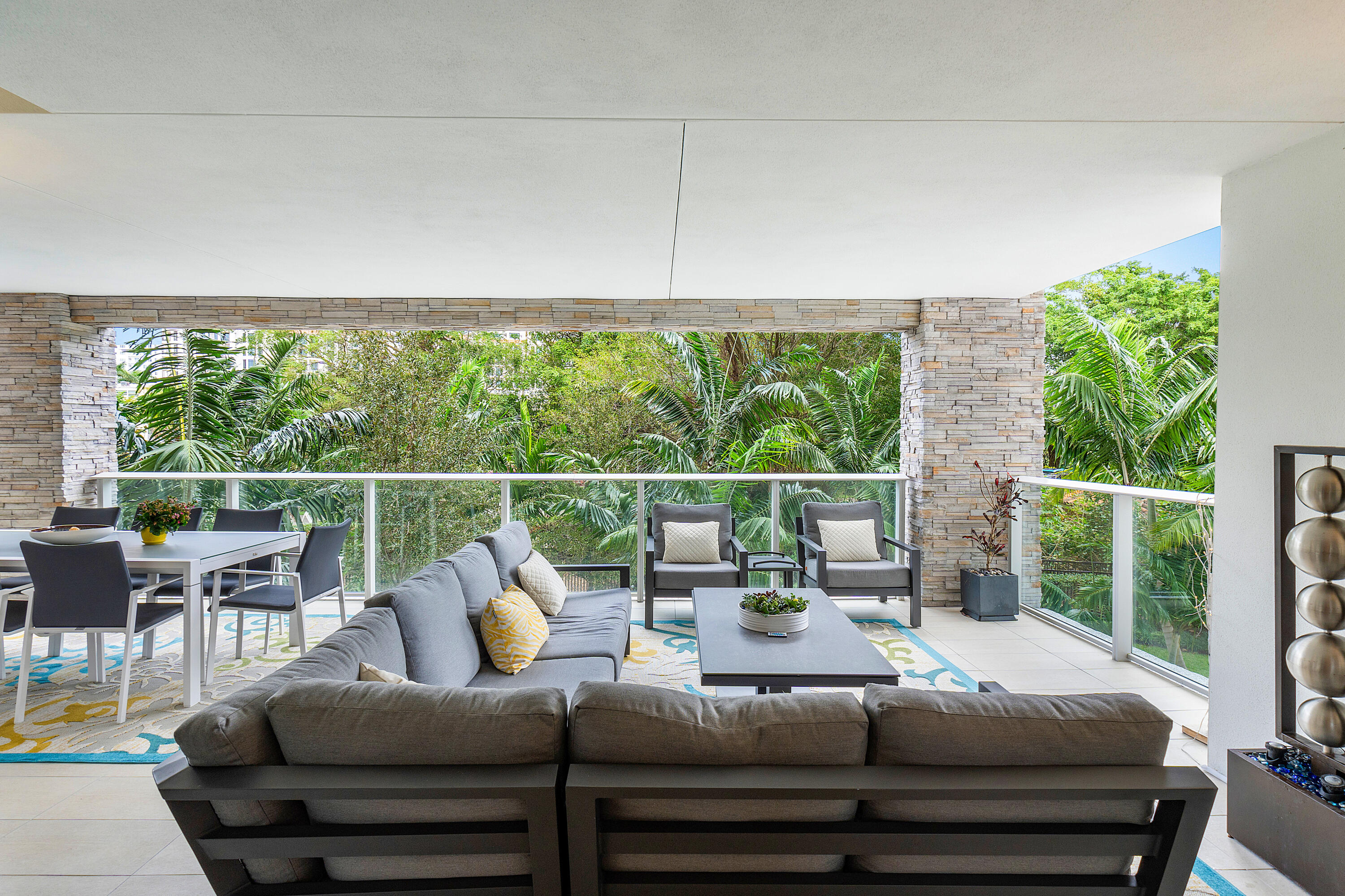 200 Southeast Mizner Boulevard, Unit 216 Boca Raton, FL 33432 - Photo 2 of 59 a living room with furniture and a large window
