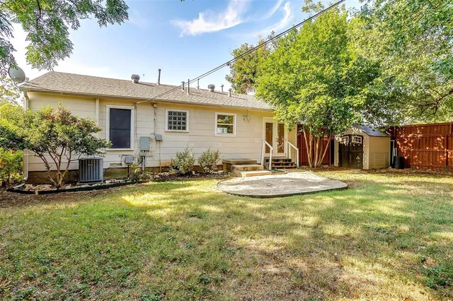 a view of a house with swimming pool and sitting area