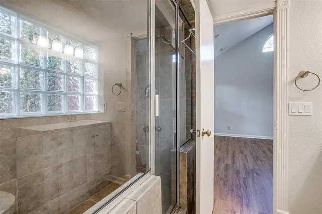 a bathroom with a bathtub and a shower