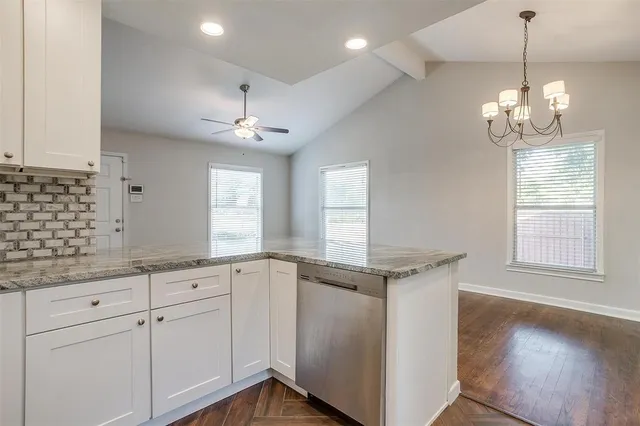 a view of a kitchen with marble kitchen and sink