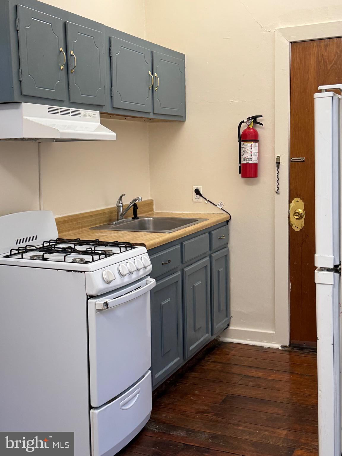 15 West Union Street, Unit 1 Burlington, NJ 08016 - Photo 4 of 8 a kitchen with stainless steel appliances granite countertop a stove a sink and a refrigerator