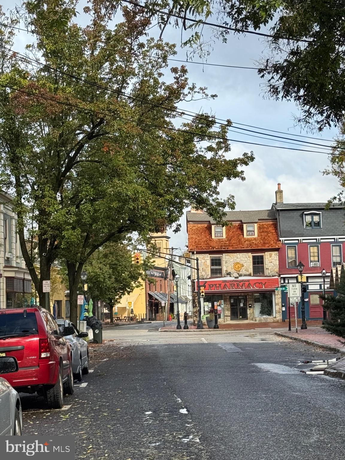 15 West Union Street, Unit 1 Burlington, NJ 08016 - Photo 8 of 8 a front view of a building with lot of cars and trees