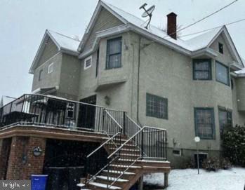 1301 Sloan Street Scranton, PA 18504 - Photo 2 of 4 a view of a house with wooden stairs