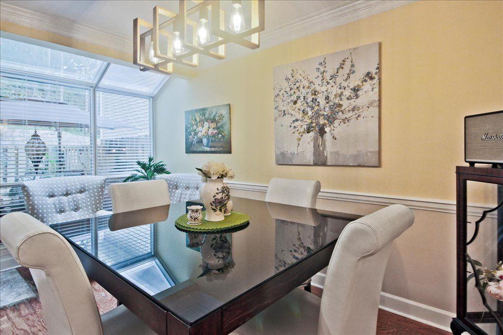 65 Mt Vernon Circle Sandy Springs, GA 30338 - Photo 12 of 44 a view of a dining room with furniture window and wooden floor
