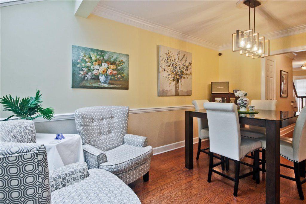 65 Mt Vernon Circle Sandy Springs, GA 30338 - Photo 14 of 44 a living room with furniture a chandelier and a dining room