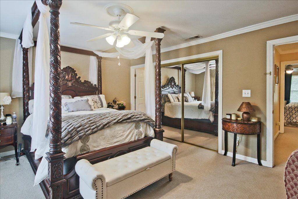 65 Mt Vernon Circle Sandy Springs, GA 30338 - Photo 23 of 44 a bedroom with a bed and ceiling fan