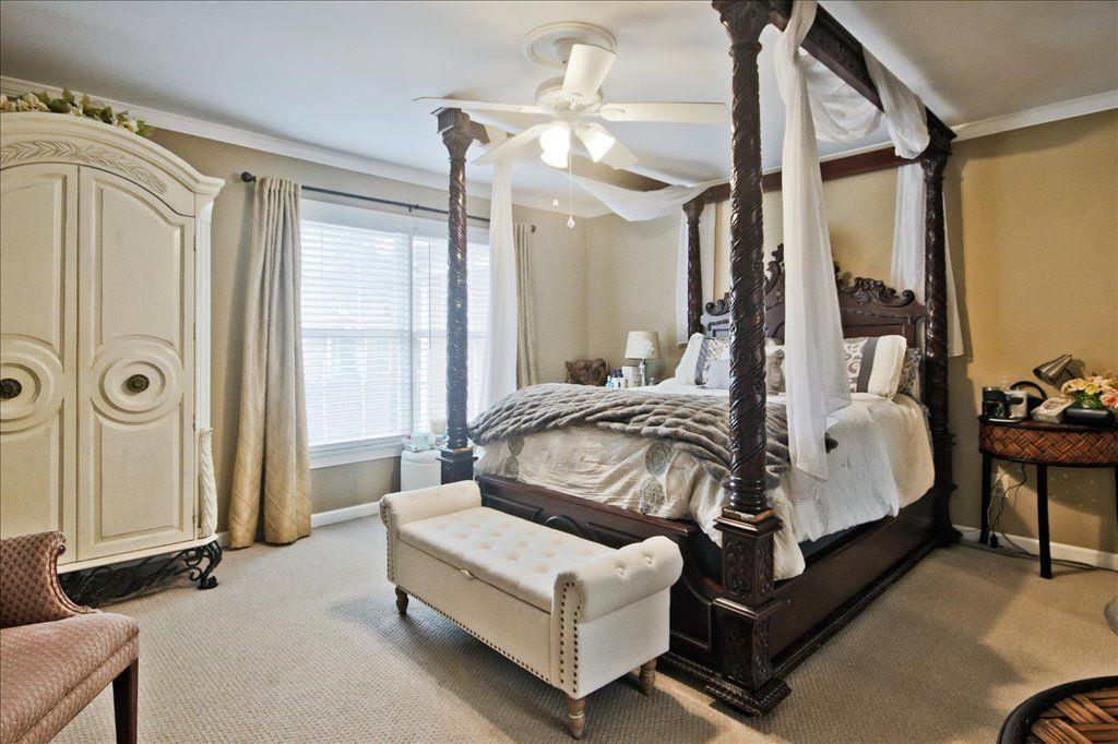 65 Mt Vernon Circle Sandy Springs, GA 30338 - Photo 24 of 44 a spacious bedroom with a bed couch and a window