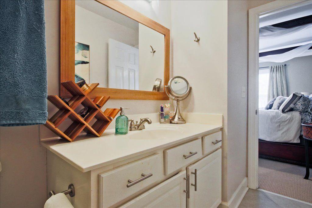 65 Mt Vernon Circle Sandy Springs, GA 30338 - Photo 28 of 44 a en suite bathroom with a sink and mirror