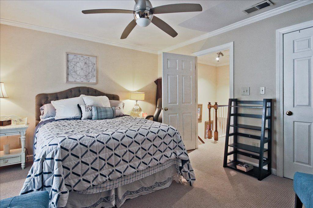 65 Mt Vernon Circle Sandy Springs, GA 30338 - Photo 29 of 44 a bedroom with a bed and a chandelier