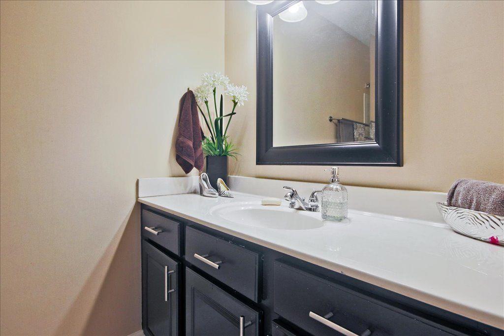 65 Mt Vernon Circle Sandy Springs, GA 30338 - Photo 31 of 44 a bathroom with a sink and a mirror