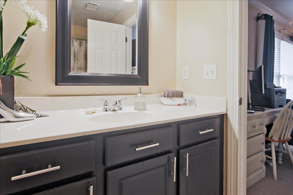 65 Mt Vernon Circle Sandy Springs, GA 30338 - Photo 33 of 44 a bathroom with a sink and a mirror