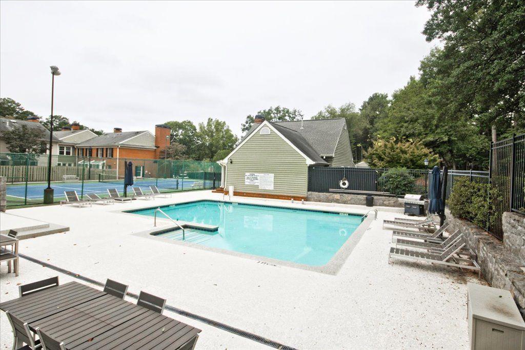65 Mt Vernon Circle Sandy Springs, GA 30338 - Photo 40 of 44 a view of a house with a swimming pool