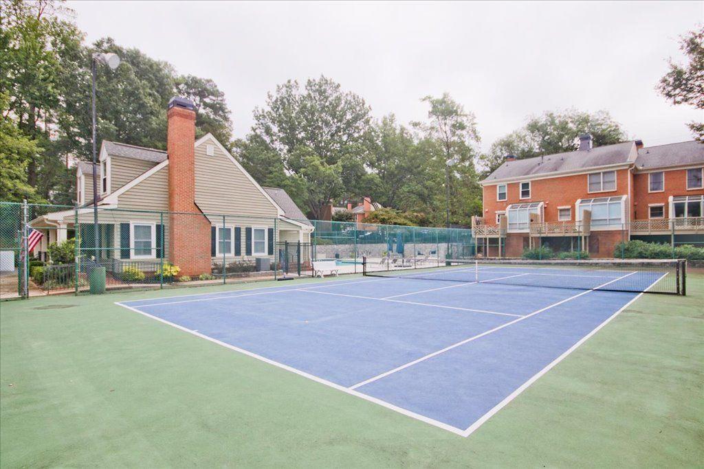 65 Mt Vernon Circle Sandy Springs, GA 30338 - Photo 41 of 44 a view of a tennis ground with large trees