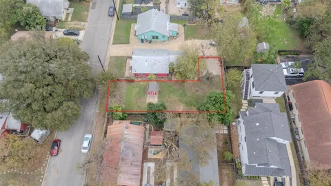 an aerial view of a house with outdoor space