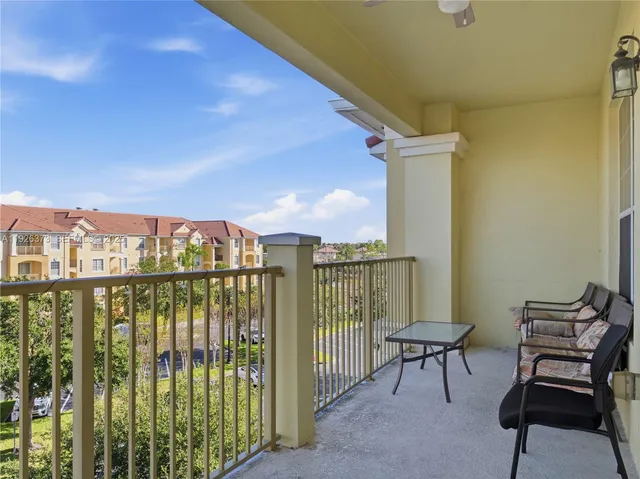 a view of a balcony with chairs