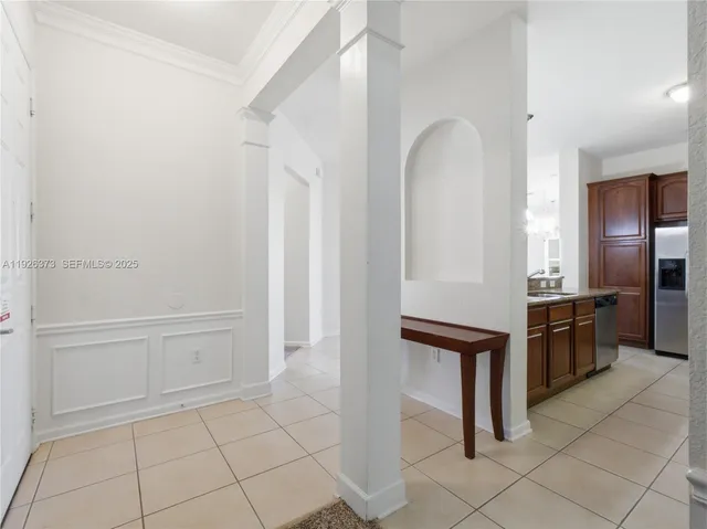 wooden floor with windows and cabinet