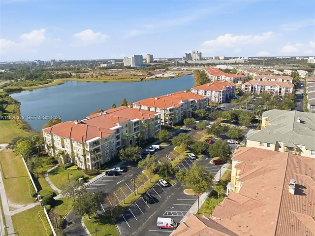 an aerial view of a city with lake view