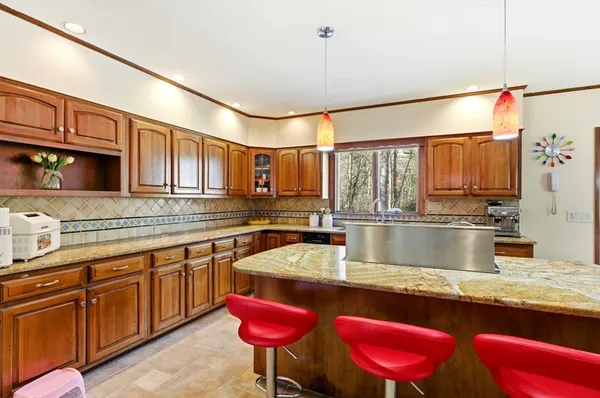 a kitchen with a table and chairs in it