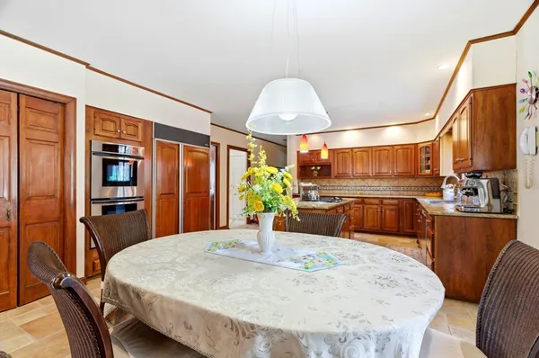 a view of a dining room with furniture window and outside view