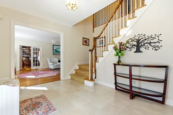 a living room with furniture and a piano