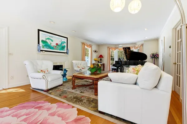 a view of a livingroom with furniture and a book shelf