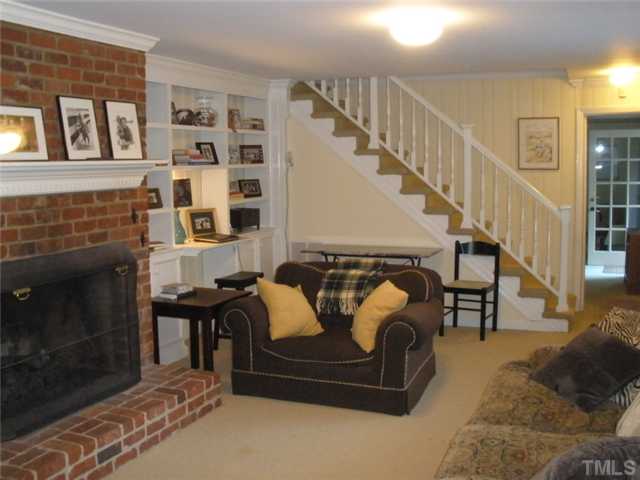 2633 Lakeview Drive Raleigh, NC 27608 - Photo 11 of 18 This is wonderful space. The family room in basement walks out to back yard, deck and garden area. Lovely bookcases, masonry fireplace with gas logs.