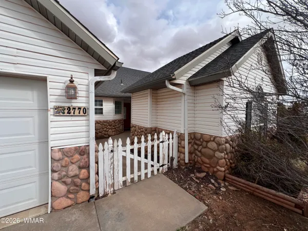 a front view of a house with a garage