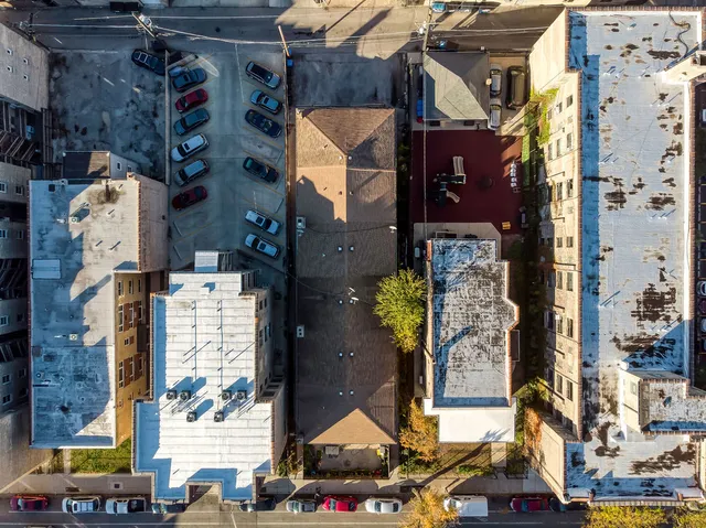 an aerial view of residential houses with outdoor space