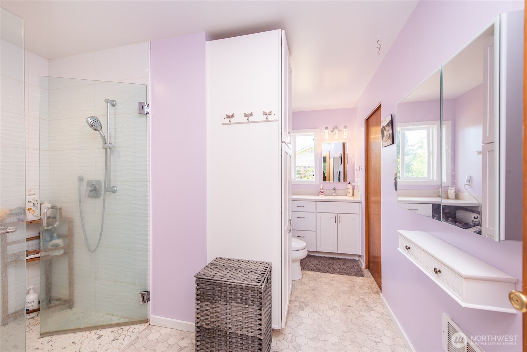 307 East Fir Street Sequim, WA 98382 - Photo 20 of 29 a bathroom with a granite countertop sink a mirror a bathtub and shower