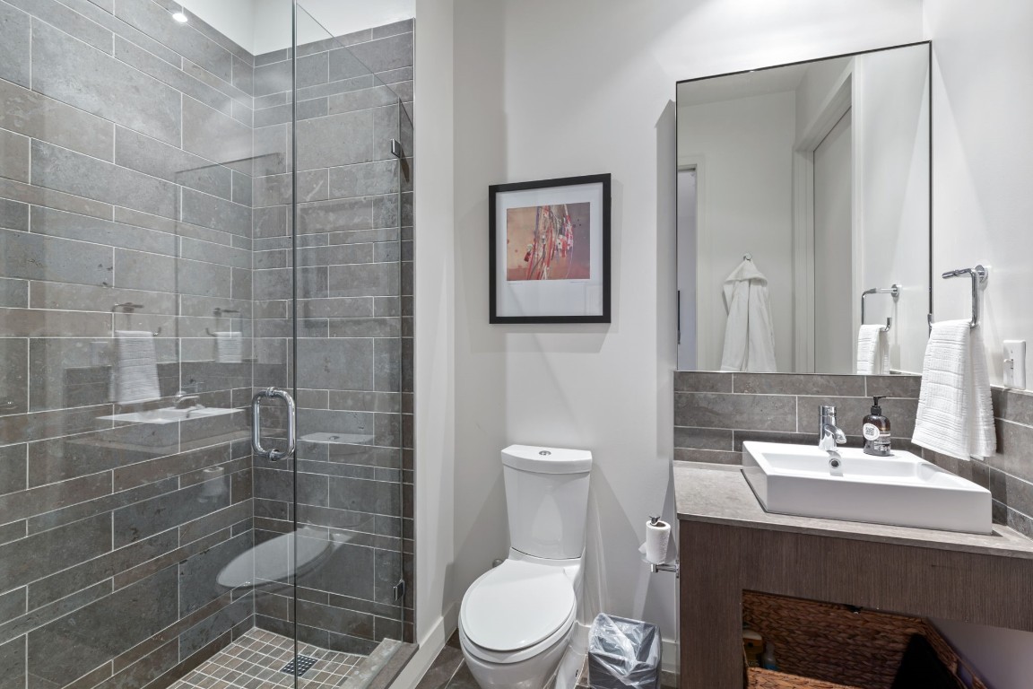210 Lavaca Street, Unit 1902 Austin, TX 78701 - Photo 17 of 40 a bathroom with a sink a toilet and shower