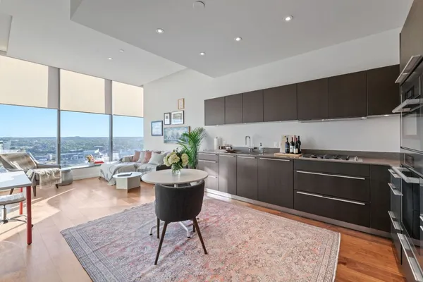 a kitchen with a table and chairs
