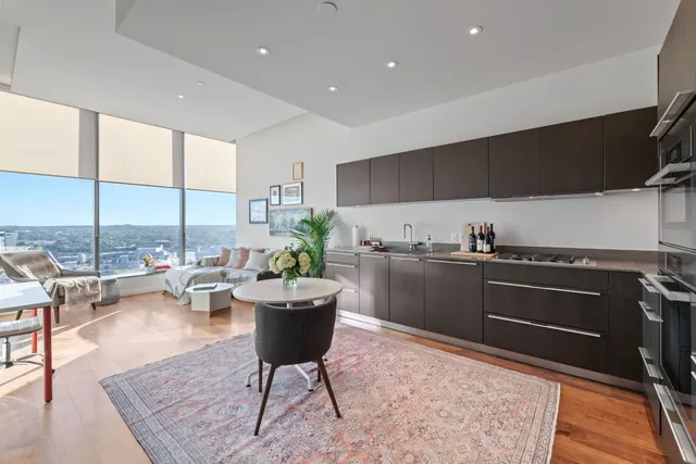 a kitchen with a table and chairs