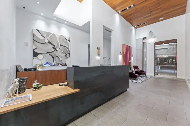 a room with lots of residential furniture and wooden floor