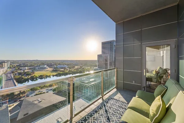 a view of balcony with furniture