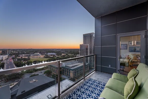 a view of roof deck with furniture