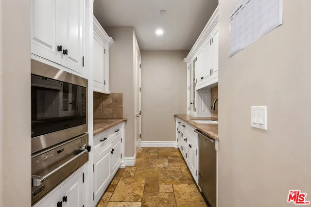a living room with granite countertop furniture and a fireplace