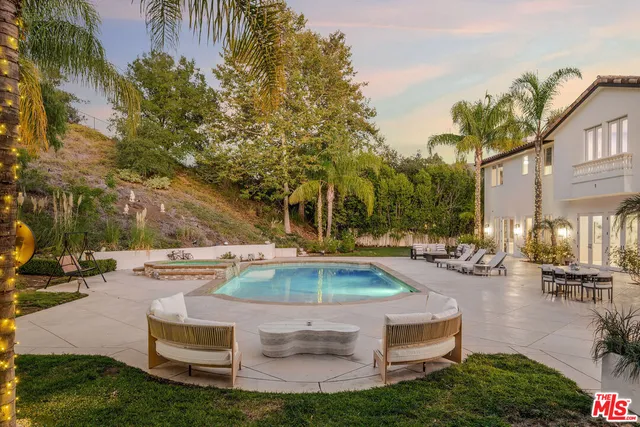 a front view of a house with swimming pool