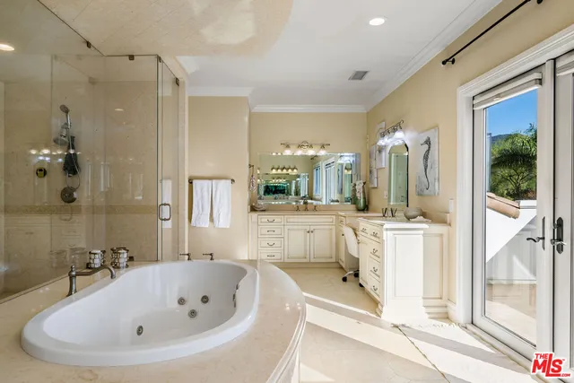 a view of a dining room with wooden floor table and chairs