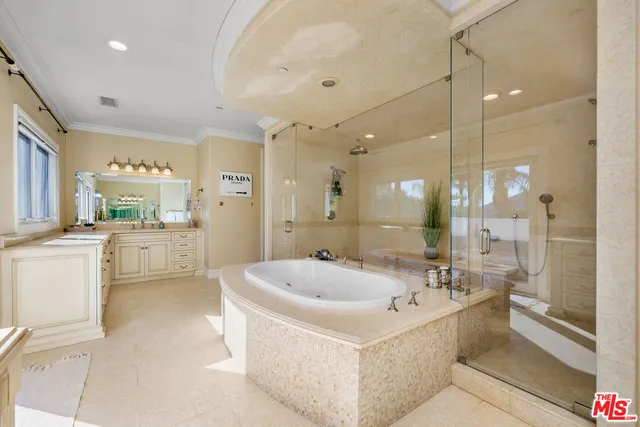 a front view of a house with garden and trees