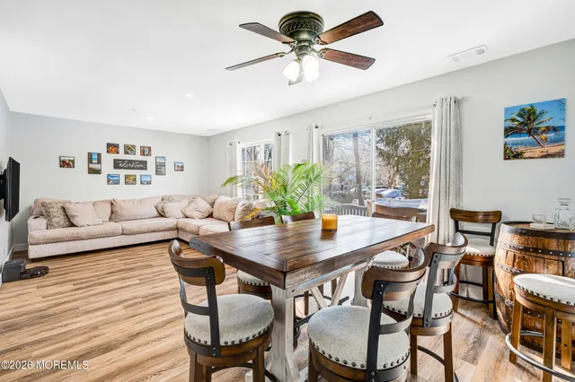 a view of a livingroom with furniture and a table