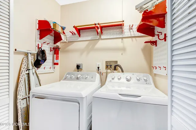 a utility room with dryer and washer