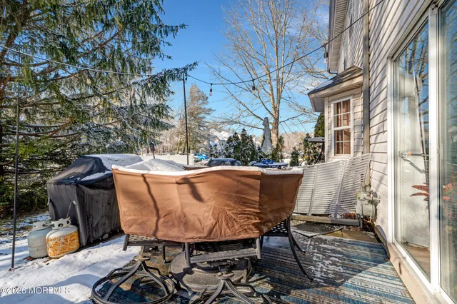 a view of balcony with wooden floor and outdoor seating
